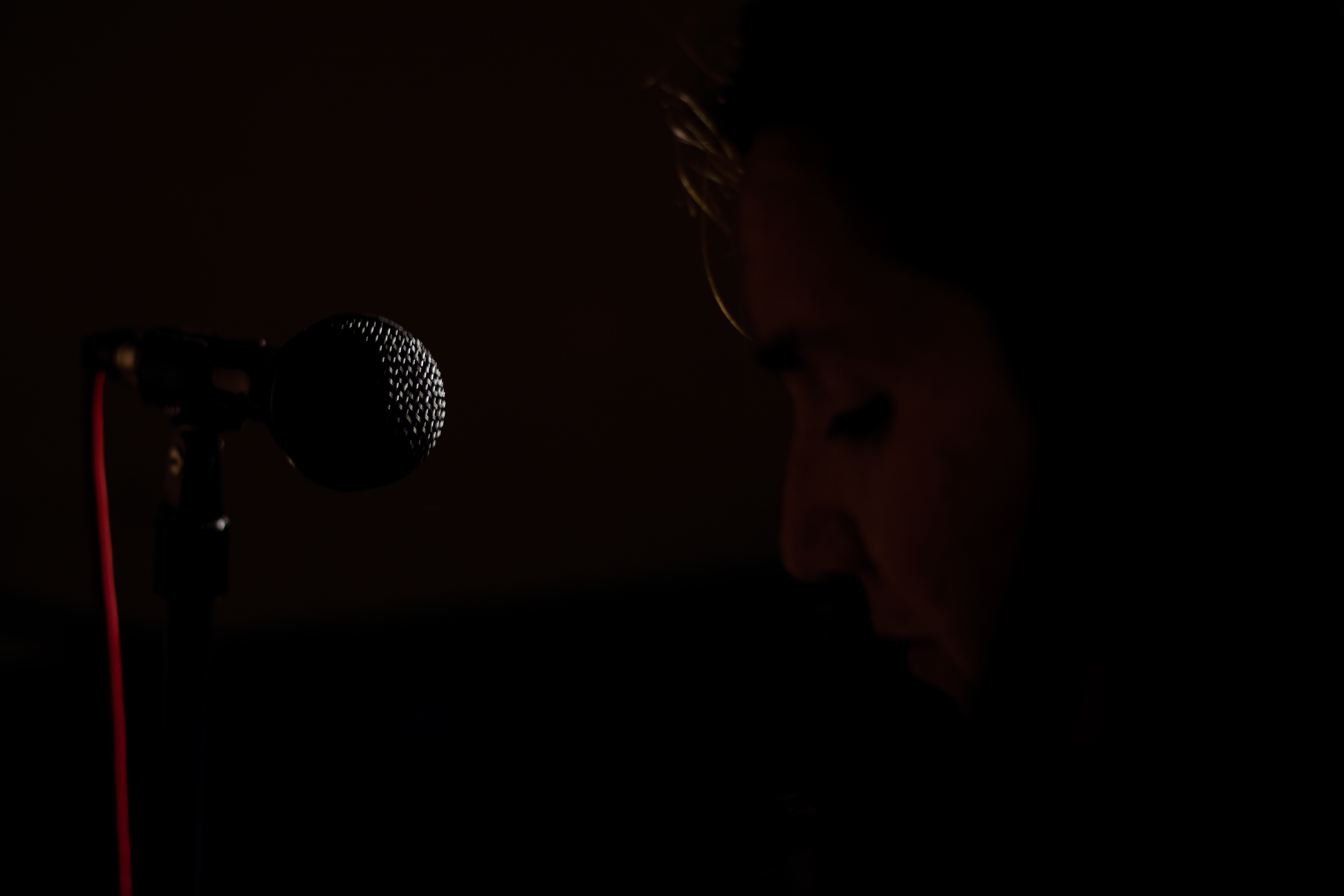 woman at computer in dark room